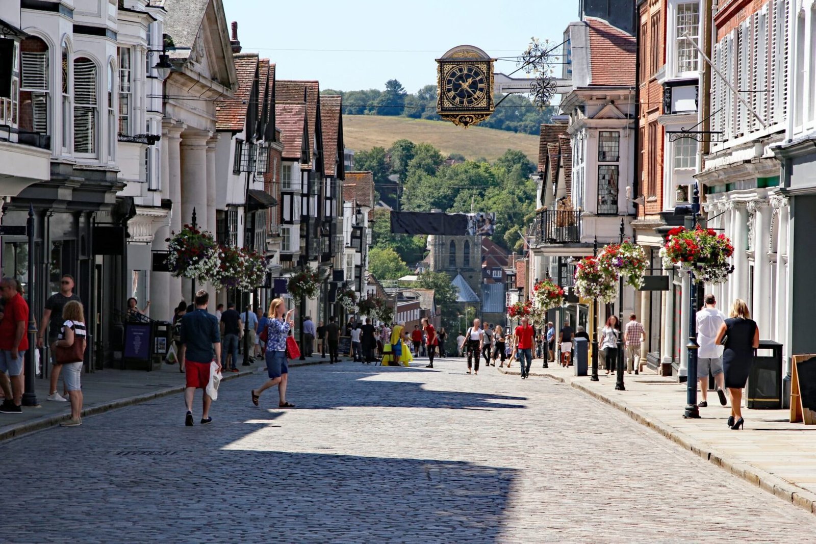 guildfords-cobbled-high-street-bustling-with-anonymised-shops-and-shoppers-2